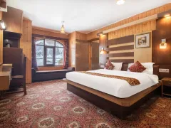 Elegant spacious hotel bedroom interior view.