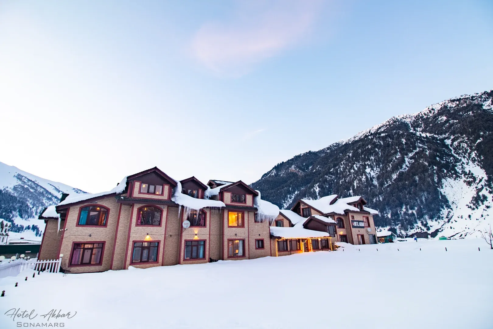 Luxury hotel amid pristine snowy mountains.