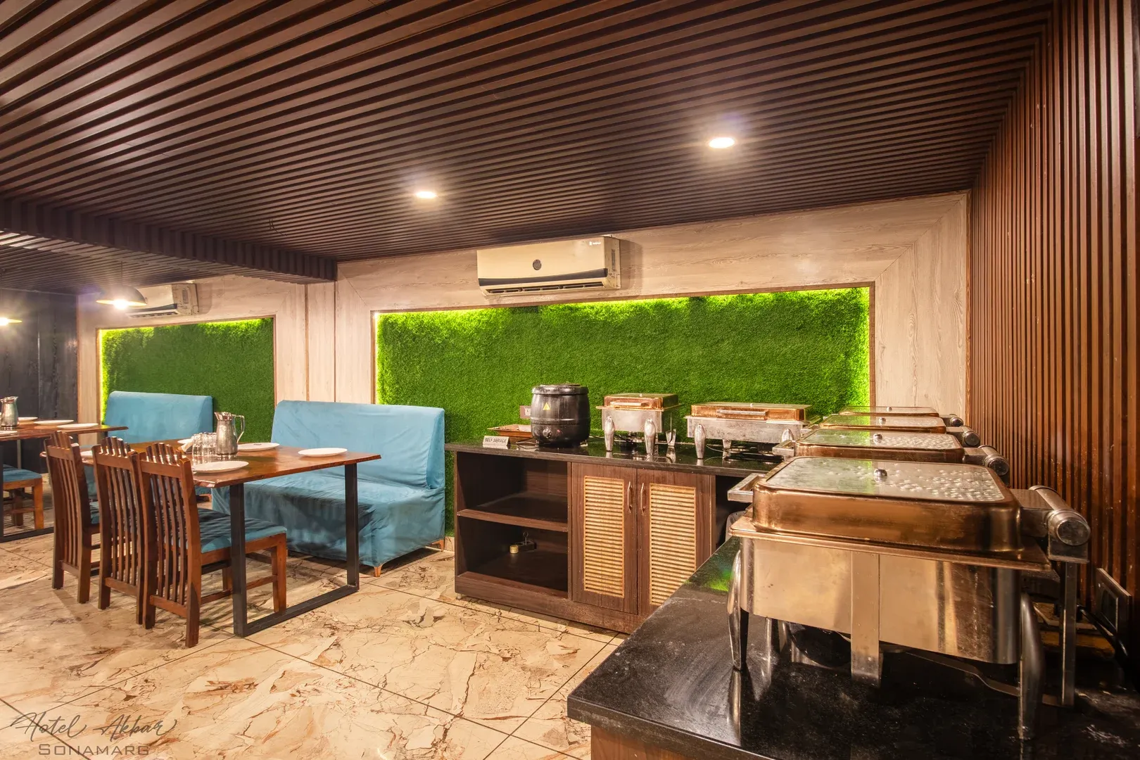 Modern wooden lobby seating and restaurant area.