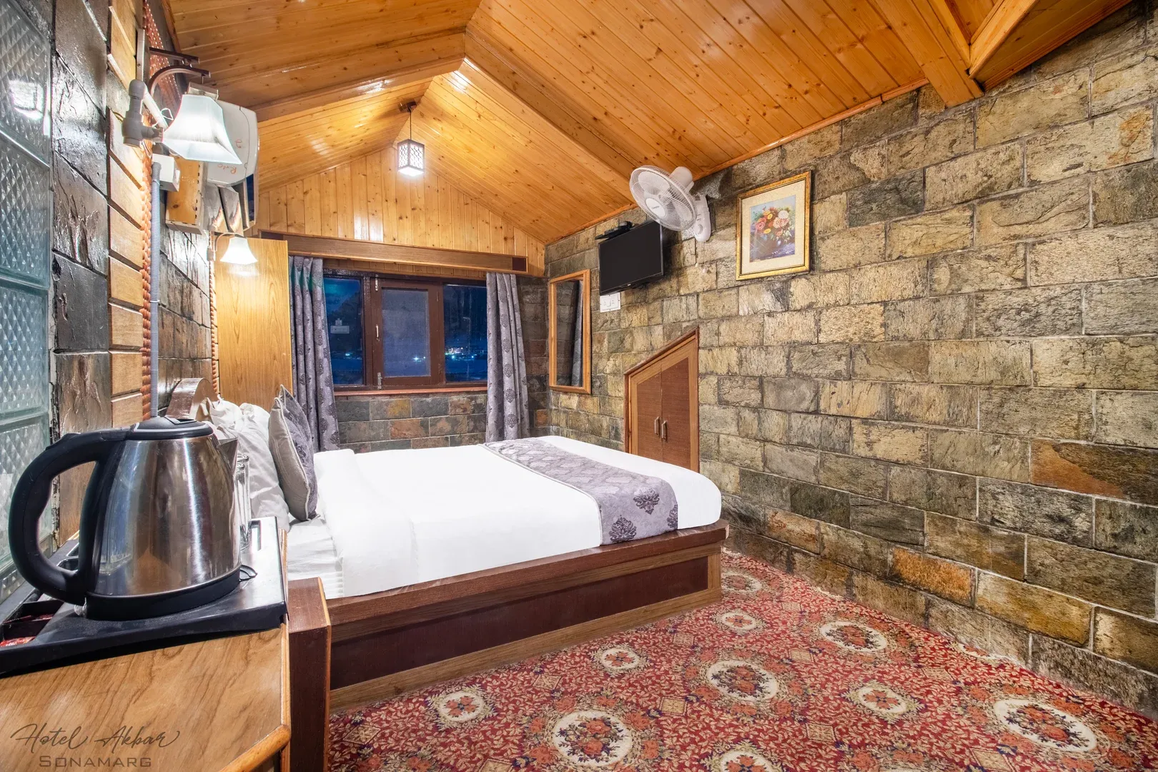 Stone-walled wooden cozy luxury bedroom.