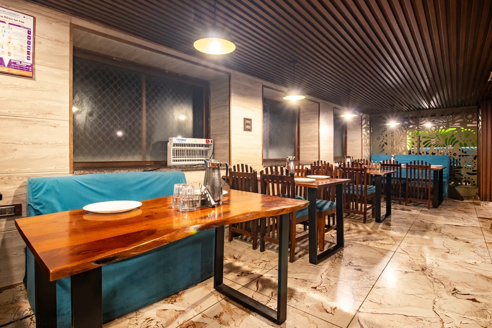 Upscale dining area featuring rich wood furniture.